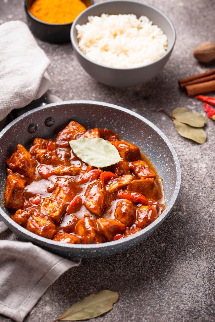 Curry chicken tikka masala with rice and spices